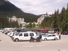 This file image shows the parking lot outside of the Fairmont Chateau Lake Louise at capacity.