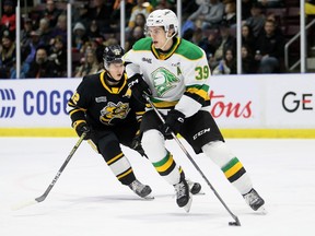 London Knights' Max McCue (39) is chased by Sarnia Sting's Easton Wainwright (12) in the first period at Progressive Auto Sales Arena in Sarnia, Ont., on Wednesday, Jan. 10, 2024. Mark Malone/Chatham Daily News/Postmedia Network