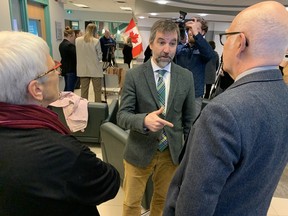 Federal Environment Minister Steven Guilbeault speaks with Green party Leader David Coon and his wife, professor Janice Harvey