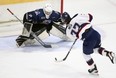 Owen Sound Attack goalie Matthew Koprowski stares down Saginaw Spirit star Michael Misa during Ontario Hockey League action at the Harry Lumley Bayshore Community Centre in Owen Sound on March 2, 2024. (Greg Cowan/Postmedia Network)