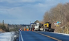 crews clean up a collision site