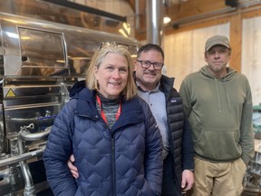 The heart of maple syrup-making is the evaporator. Shiny stainless steel components are supplemented with monitoring devices and flow valves. Concentrating the flavour also boosts the sugar content to become the syrup we so know and love. From the left are owners Céline and Michel Larivière, and production expert Trevor Johnston. Hugh Kruzel photo