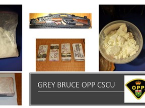 Photo of drugs, weapons and cash seized by the OPP while executing a search warrant in Meaford. Photo supplied.