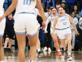 Lambton Lions' Legacie Blackbird (12) and Maddy Bishop celebrate after winning the OCAA women's basketball championship at Lambton College in Sarnia, Ont., on Sunday, March 3, 2024. Mark Malone/Chatham Daily News/Postmedia Network