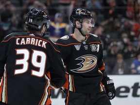Anaheim Ducks center Adam Henrique, right, celebrates his goal against the Buffalo Sabres with center Sam Carrick during the third period of an NHL hockey game Tuesday, Jan. 23, 2024, in Anaheim, Calif. THE CANADIAN PRESS/AP, Ryan Sun