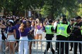 Crowds gather on Broughdale Avenue in London to celebrate Western University's homecoming on Saturday, Sept. 23, 2023. Police maintained a large presence in the area and closed Broughdale and nearby streets to vehicles. (Dale Carruthers/The London Free Press)