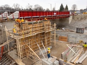 Work has progressed since this photo of the Adelaide Street underpass was taken on Wednesday, Nov. 29, 2023. Two lanes of asphalt have been laid and will soon carry a single lane of traffic north and south under the CP Rail lines. (Mike Hensen/The London Free Press)