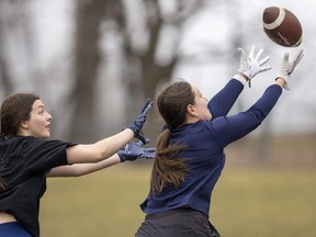 Receiver Melissa Green catches up to a nicely thrown pass behind the coverage of Alexandra Lannin at a practice of the Western University women's flag football team on Sunday, March 3, 2024. (Mike Hensen/The London Free Press)
