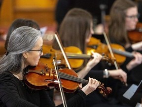 The string section of the London Community Orchestra plays Romance in F, Opus 85 by Max Bruch during a concert at the Dundas Street Centre United Church in London on Sunday March 3, 2024. (Mike Hensen/The London Free Press)