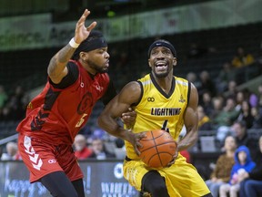 Jeremiah Mordi of the London Lightning is covered closely by Ja’Myrin Jackson of the Sudbury 5 during their NBL game Tuesday night at Budweiser Gardens in London, Ont. on Tuesday March 5, 2024.