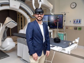 Jonathan Collier, manager of transformation and innovation at London Health Sciences Centre, wears high-tech goggles some surgeons are testing out in low-risk procedures.  Photo taken on March 7, 2024. (Derek Ruttan/The London Free Press)
