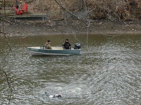 Sunday afternoon OPP dive team members recovered the body of a missing 16-year-old girl from the Sydenham River, downstream from the Jubilee Bridge. Her family reported her missing Saturday. (Scott Dunn/The Sun Times/Postmedia Network)