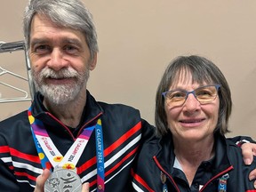 Special Olympics Owen Sound athlete Martin Soder and Norma Breadner celebrate winning a silver medal in team 5-pin bowling at the Special Olympics Canada Winter Games in Calgary. Photo from Special Olympics Owen Sound