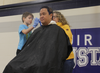 Kyler Reiland, dyes Principal Andy Fūnes hair after raising the most money for the school's new playground. Photo by Alyssa Gallardo.