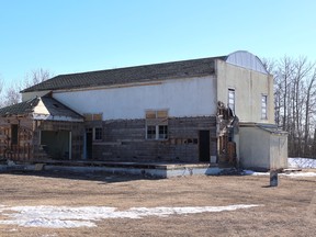 A large historic building being demolished