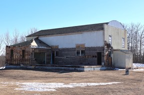 A large historic building being demolished