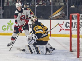 Brad Gardiner of the Ottawa 67s watches as Brantford Bulldogs goalie Matteo Drobac blocks his shot during the first game of their OHL Jr A playoff series on Friday March 29, 2024 at the Civic Centre in Brantford, Ontario. Brian Thompson/Brantford Expositor/Postmedia Network