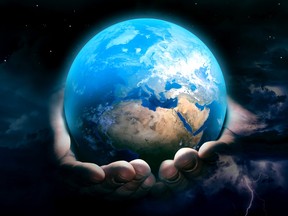 Stock photo illustration of hands holding the Earth