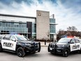 Kingston Police unveil the new design of their organization's vehicles at their headquarters in Kingston, Ont., on Tuesday, March 19, 2024.
