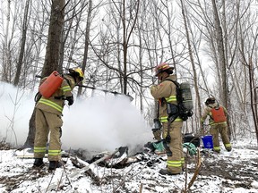 Kingston firefighters extinguishes a tent fire at a homeless encampment in Belle Park