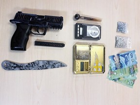 A BB gun, throwing knife, a digital scale, cash, fentanyl, and psilocybin mushrooms seized by Kingston Police from a individual on Monday, March 25, 2024.