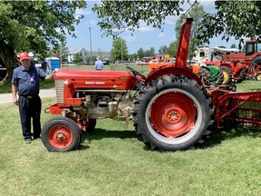 Wayne Conboy stands with his 1957 Massey-Harris 50