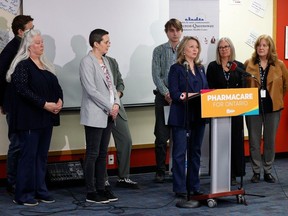 Mike Bleskie, fourth from right, listens in as Ontario NDP Leader Marit Stiles addresses the media during a news conference in Ottawa on Wednesday.