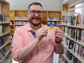 Grant Richard, a library technician Sarnia's downtown library, shows off a Smart Card Library Pass for use on the Huron Shores Area Transit System. The smart cards can be borrowed at several libraries in communities served by the system's Sarnia to Grand Bend transit route.