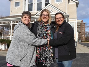 A group of local campers is holding a polar bear plunge Saturday at the main beach at Sarnia's Canatara Park to raise money for St. Joseph's Hospice Sarnia-Lambton.  Organizers Tammy Tulloch, left, and Tammy Haslip, right, flank hospice special events co-ordinator Tammy Witcher outside the hospice in Sarnia.
