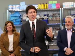 Canadian Prime Minister Justin Trudeau, middle, addresses the media during a visit to the Labelle Innovation and Learning Centre at Health Sciences North in Sudbury, Ont. on Friday March 1, 2024.