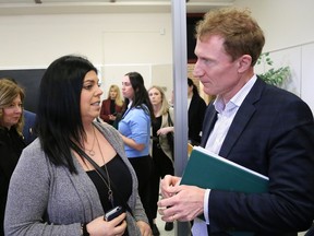 Marc Miller, minister of Immigration, Refugees and Citizenship, chats with Marie-Josee Tremblay, of Reseau du Nord Francophone Immigration Support Network, in Sudbury, Ont. on Wednesday March 6, 2024.