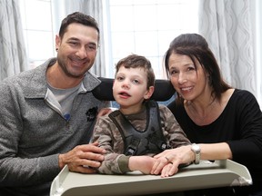 Daniel Brousseau and Tina Senior with their six-year-old son Alex at their home in Val Caron, Ont.