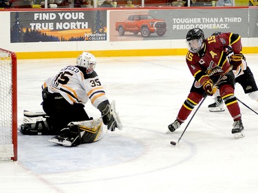 Timmins Rock forward Harry Clark backhands a shot past Iroquois Falls Storm goalie Connor Hatfield for one of his two third-period power-play goals during Game 1 of their East Division semifinal series at the McIntyre Arena Friday night. Clark's goals helped lift the Rock to a 5-1 victory over the Storm. THOMAS PERRY/THE DAILY PRESS