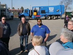 Josh Harding, HGC Management operations manager at the Norfolk Materials Recovery Facility in Simcoe, centre, talked about the sorting and baling facility and answered questions during a tour Wednesday morning.  CHRIS ABBOTT