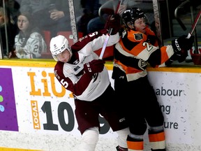 Martin Matejicek hits his former defensive partner Braedyn Rogers in the first period as the Owen Sound Attack play the Peterborough Petes inside the Harry Lumley Bayshore Community Centre on Saturday, March 3, 2024. Greg Cowan/The Sun Times