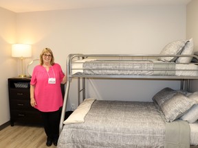 Alynn Ward, Wellspring crisis intervention worker, showed off this new bedroom in the Whitecourt shelter in late 2023. The Wellspring Family Resource and Crisis Centre doubled its capacity from 11 to 22 beds. Provincial funding of $10 million over four years to recipients in 17 communities (including Whitecourt) will help Wellspring make use of the new beds.
