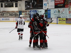 Whitecourt Wolverines players, including Jarred Feist and Dylan Leslie, celebrated their first goal in the first round of 2023-24 AJHL playoffs, made by Shayne Tibbles (with Feist and Leslie assisting) during first period on March 15. The Wolverines won the game, 3-2.