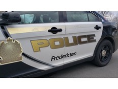Police say they've arrested two people in Fredericton in what appears by the charges to be a large-scale counterfeit operation.