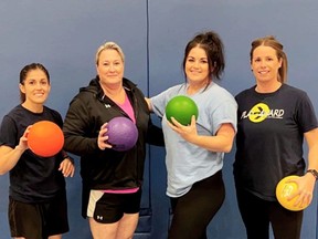 Elise Johnston, left, Shannon Bechard, Caress Lee and Katie Moore are captains in the Play it 4Ward CK women's mixed-sports league. (Supplied)
