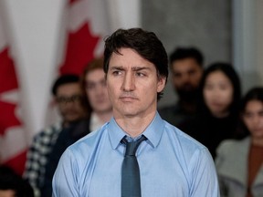 Prime Minister Justin Trudeau listens to a speaker during a housing announcement in Vancouver, Wednesday, March 27, 2024.