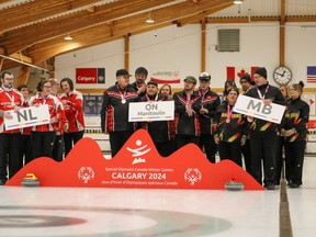 Members of the Manitoulin Manitoulin Special Olympics curling team pose for a photo at the Special Olympics Canada Winter Games in Calgary.