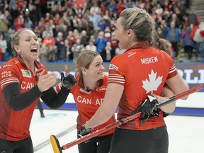 Canada skip Rachel Homan, left, celebrates with teammates Tracy Fleury, Sarah Wilkes and Emma Miskew after defeating Switzerland's Silvana Tirinzoni rink at the World Women's Curling Championship gold medal game in Sydney, N.S. on Sunday, March 24, 2024.