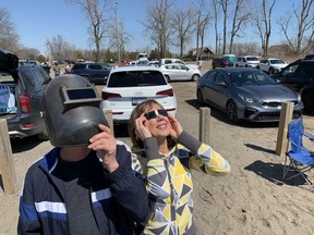 Pain Court area residents Norm and Yvette Caron were well prepared to watch the total solar eclipse from the beach in Erieau on Monday, April 8, 2024. (Ellwood Shreve/Chatham Daily News)