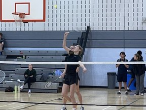 Abbey Wilson of St. John's College smashes the shuttlecock during the Athletic Association of Brant, Haldimand and Norfolk junior badminton championship at Assumption College on Wednesday. Staff