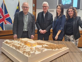 Architects Diamond Schmitt presented a new scale model of the proposed New Brunswick Museum expansion Tuesday at a meeting of the city's planning advisory board. Tracy Clinch, chair of the museum board, is seen at right, with Donald Schmitt and project architect Emily Baxter in the centre and Michael Leckman at left.