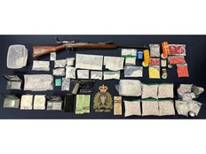 Guns, drugs and cash seized by police during a recent investigation in New Brunswick.