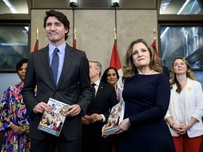 Prime Minister Justin Trudeau and Finance Minister Chrystia Freeland hold copies of Budget 2024 on Parliament Hill Tuesday.