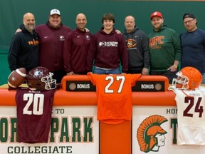 North Park Collegiate football player Michah DuChene (middle) recently signed with McMaster University. Submitted