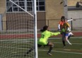 Brantford Collegiate Institute’s Tatum McAuley makes a saves against North Park Collegiate’s Jada Arthurs during AABHN girls soccer action at Kiwanis Field on Monday. Brian Smiley