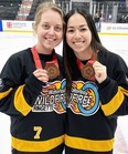 Lydia Duncan and Meghan Hanson-Fong, of Waterloo Wildfire of the NRL, show off their bronze medals as the Canadian championships